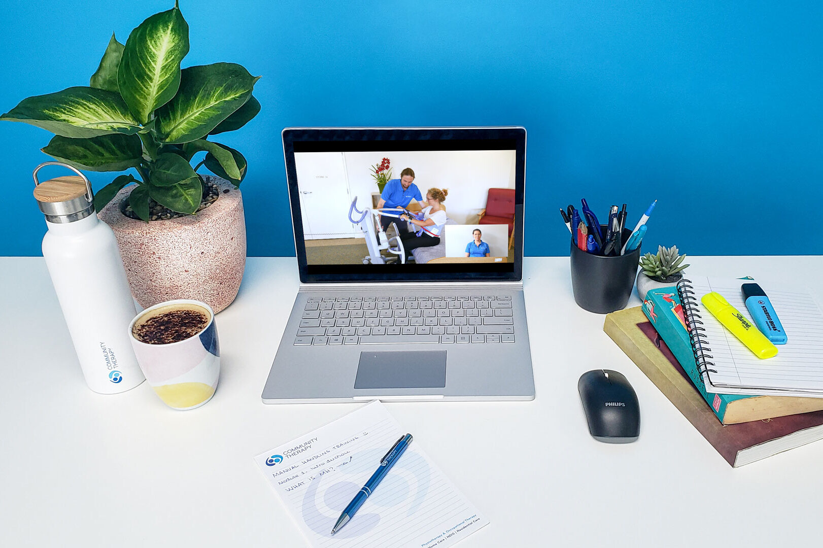 Desk, computer and notepad
