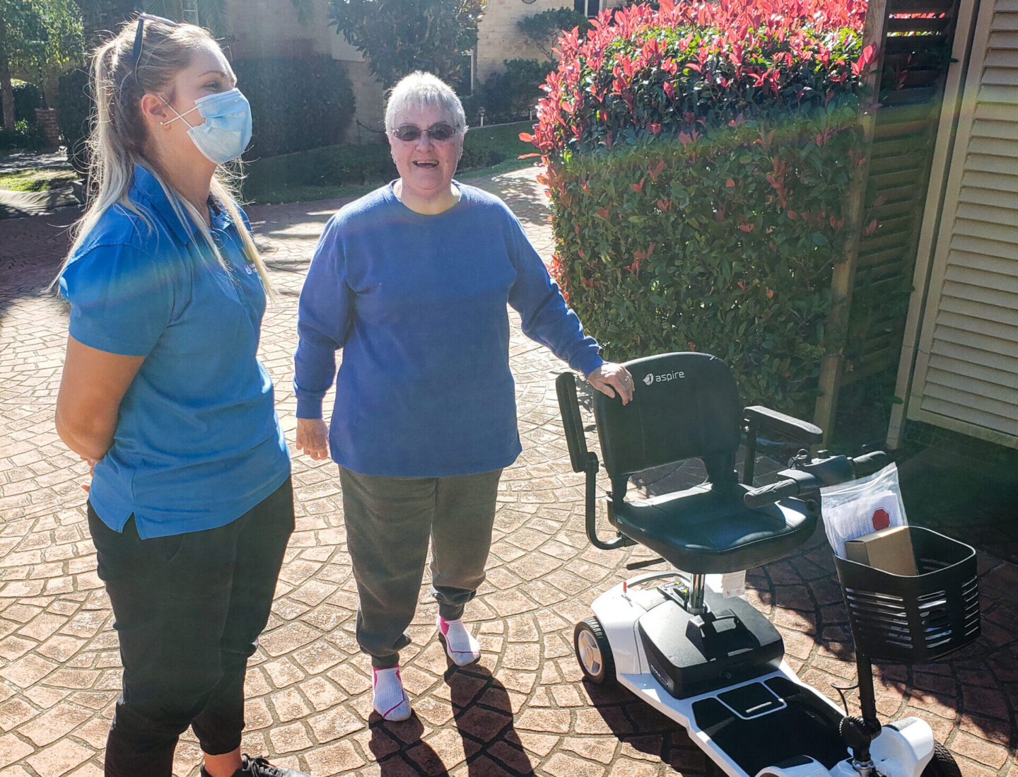 OT with client and portable scooter