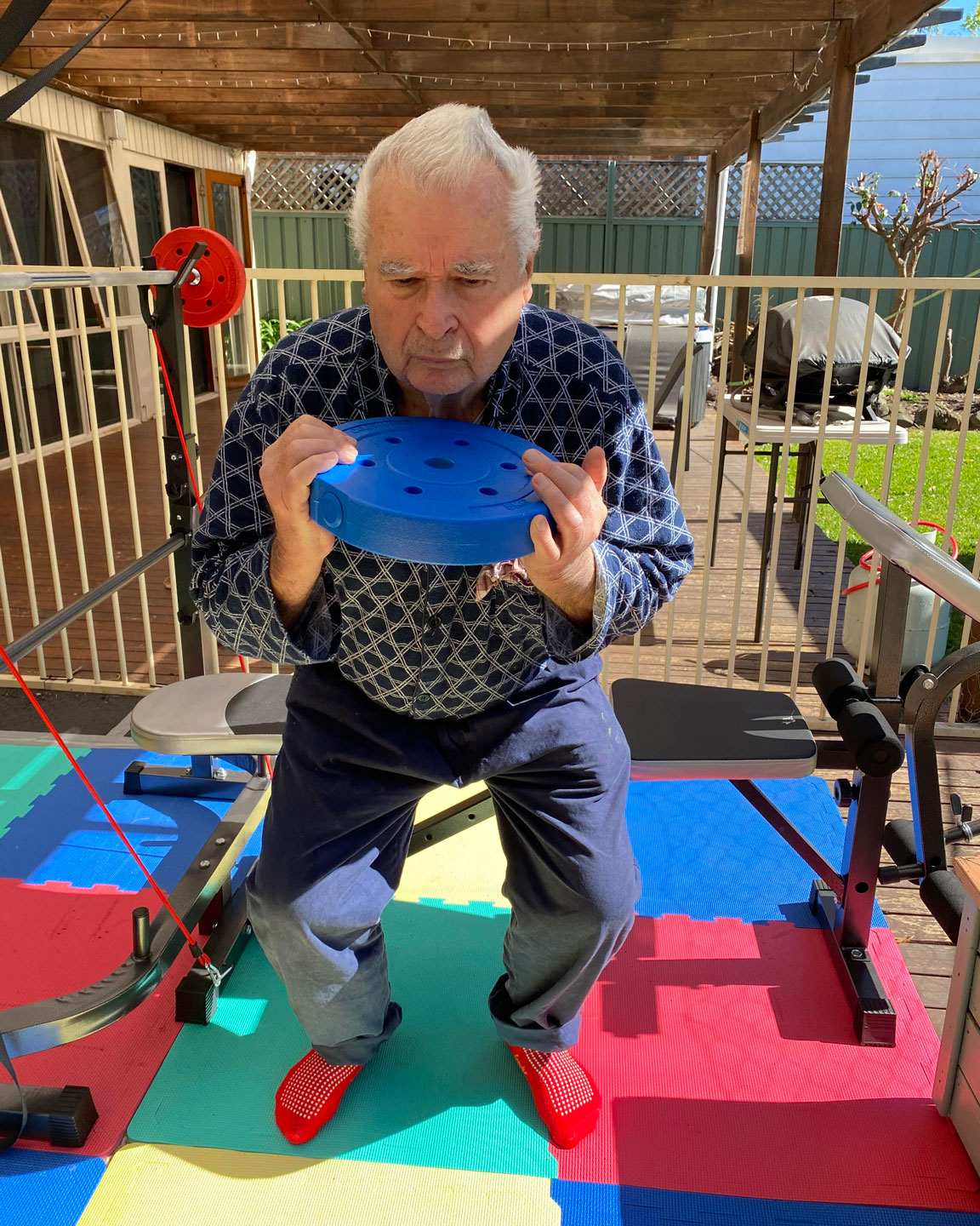 Older adult doing a weighted squat