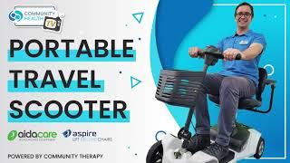 Scott riding on a portable travel scooter