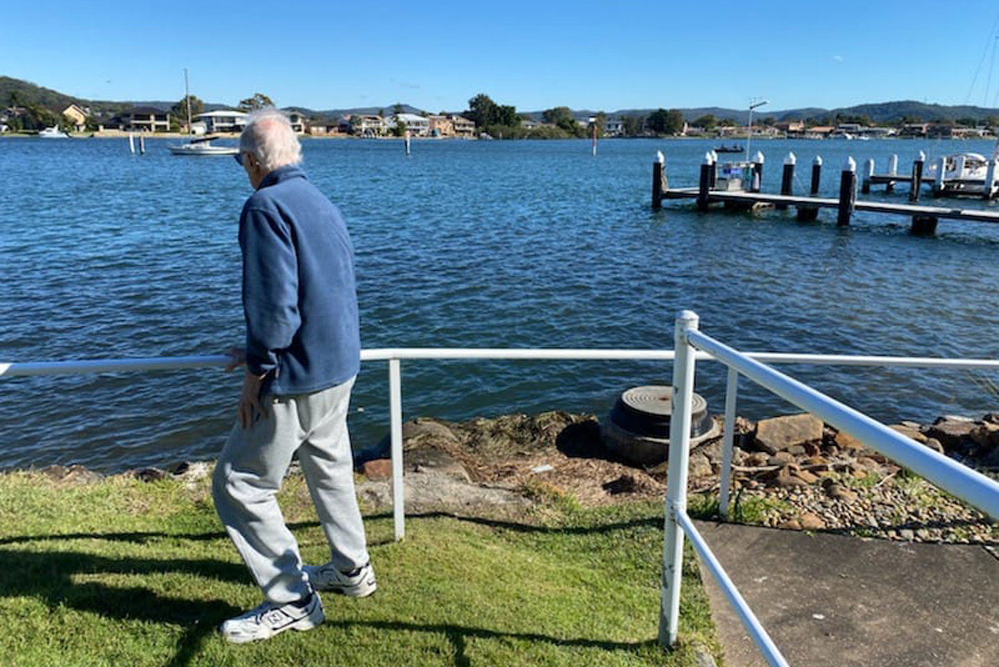 Older adult walking by the lake