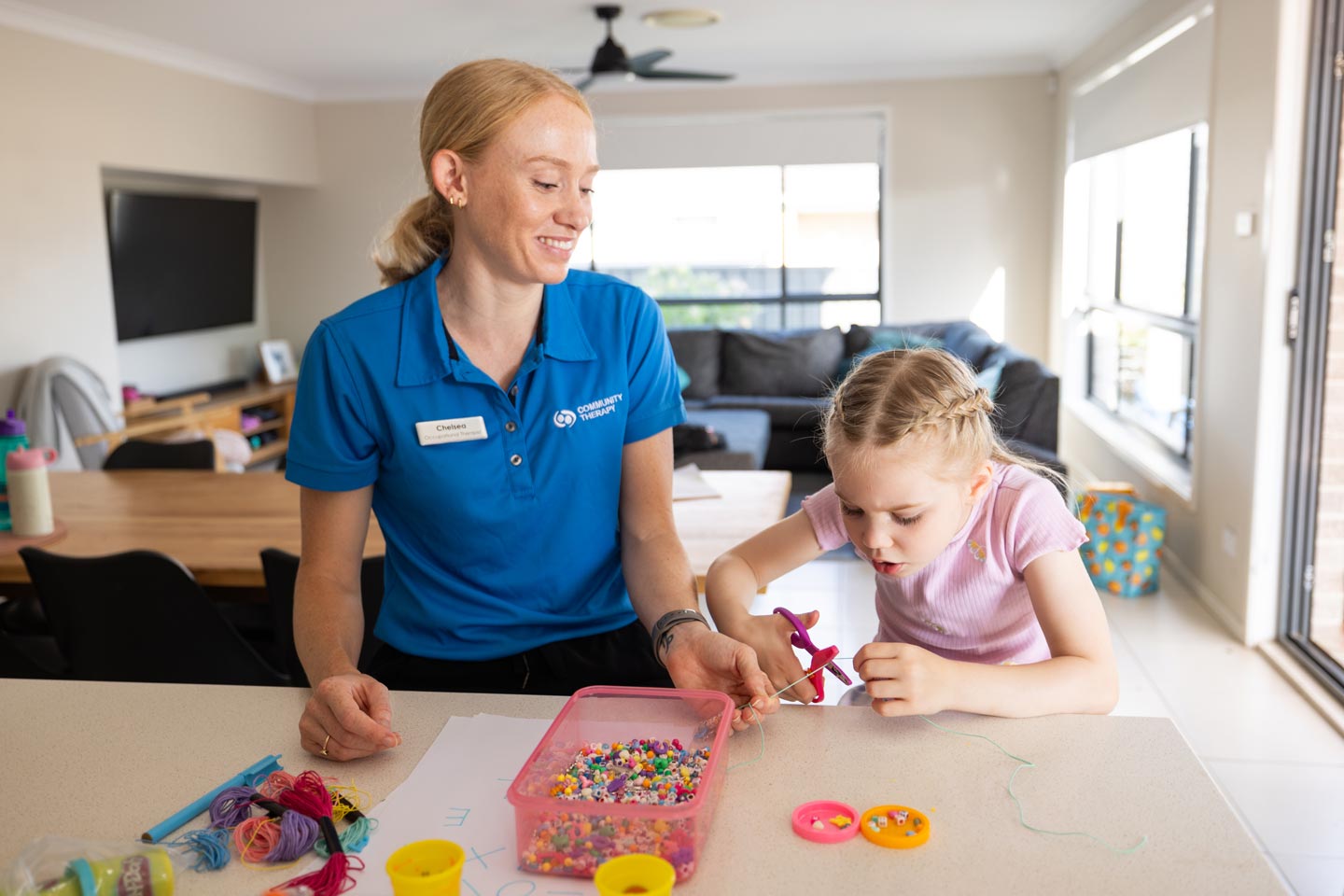 Paediatric Occupational Therapist assessing motor skills of a young client