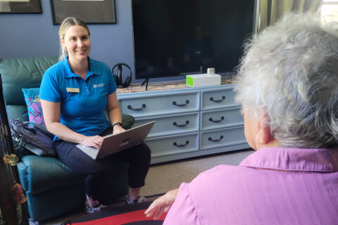 Clinician smiling at a client during an assessment