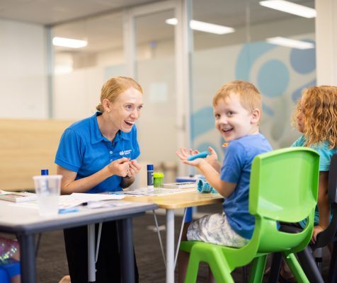 Occupational Therapist and child playing with play-doh