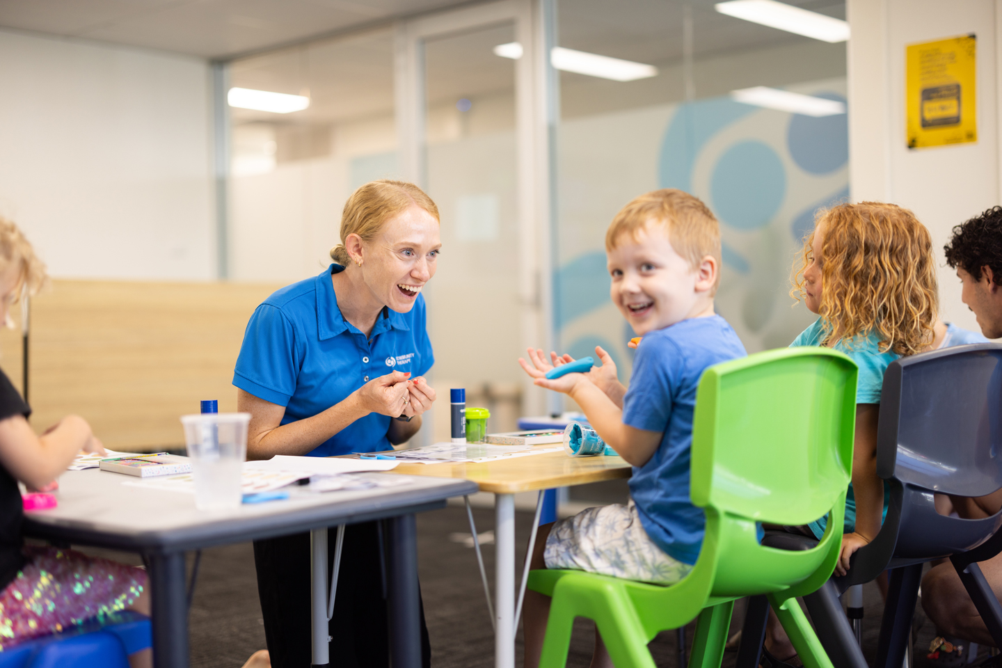 Occupational Therapist and child playing with play-doh